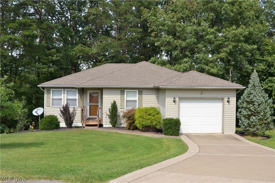 No more mowing or snow shoveling when you buy this well-maintained condo.  Ideal one level living in this secluded condominium neighborhood. Tucked behind the Hidden Meadows Complex on Lancaster, this single family home is one of four homes at the end of the cul-de-sac.  this home is the end unit offering privacy and lovely wooded views from the deck or patio.  A master suite with en-suite bath and large closet plus two more bedrooms share a second a full bath.  Large living room leads to a spacious kitchen with room for a dining table.  Beautiful oak floors in the main areas with plush carpeting in the bedrooms and ceramic tile in the baths.  A washer and dryer are tucked into a nook in the garage with easy access to the bedrooms.