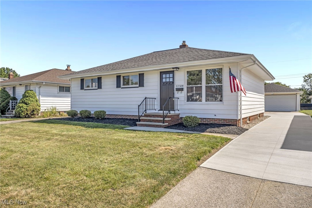 Welcome to 12508 Eastwood Blvd in Garfield Heights, a beautifully updated 3-bedroom, 2-bathroom home with thoughtful renovations inside and out. This property offers a detached 2-car garage, a spacious partially finished basement complete with a bar, and stylish finishes throughout. The eat-in kitchen has been completely refreshed with brand-new cabinets, vanities, countertops, subway tile backsplash, and stainless steel appliances, including a refrigerator, range, dishwasher, microwave, and Insinkerator disposal. Both bathrooms shine with bright white finishes, while the entire home has been repainted with neutral tones and upgraded with new wood plank vinyl flooring, modern lighting fixtures, hardware, switches, outlets, and cover plates. Recent improvements extend to the exterior as well, including new paint, a Craftsman-style front door, 2-panel back door, all new concrete patio, partial drive and walkways, and a new vinyl double-hung living room window. Additional updates include glass block windows in the basement, white wire closet shelving, and professionally cleaned interiors. The home also benefits from a newer architectural dimensional shingle roof, newer electrical panel, and a newer garage door with operator and controls. With ample curb appeal and a move-in ready interior, 12508 Eastwood Blvd combines charm, modern updates, and functionality in a prime Garfield Heights location.