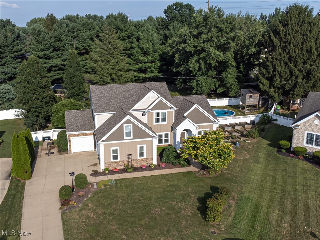 Welcome home to this beautifully maintained 5-bed, 3-bath colonial nestled in the heart of Massillon & part of the Jackson School District. This lovely home sits on a private cul-de-sac lot & offers an open floor plan with 2,561 sq. ft. of living space. As you step into the wide foyer, notice to your right a bright & private home office with French doors. It is ideal for remote work or quiet study. To the left, a formal dining room awaits. It has an arched entryway perfect for hosting gatherings & holiday dinners. Straight ahead, the two-story family room with a gas fireplace & soaring vaulted ceilings, which creates a stunning focal point. It flows seamlessly into the eat-in kitchen, complete with ample cabinetry & space for casual dining. Notice the lovely hardwood floors, tile backsplash & granite countertops, plus all stainless steel appliances are included! Completing the main level is a versatile bonus room, making it ideal for a bedroom for guests or multigenerational living, a full bath & a convenient laundry room - washer & dryer are included. Upstairs, you'll find three spacious secondary bedrooms along with a luxurious owner’s suite. The owner’s retreat boasts a sitting area, providing plenty of space to relax & unwind. The large en-suite bathroom offers a walk-in shower & dual vanities. The full, unfinished basement offers endless possibilities; create your dream media room, home gym, or additional living space; the choice is yours. If you love being outside, you are going to love the fully-fenced backyard oasis featuring a Koi pond with 2 waterfalls, a composite deck & an oval above-ground pool installed in 2019. Updates include over $40K in recent renovations. The front of the home was redesigned, & solar panels were installed in 2020 - cutting the electric bill in half. Furnace 2023, AC 2019, water tank 2024, replacement windows & slider 2023 & roof 2022. Don't miss the opportunity to make this beautifully cared-for colonial your forever home!