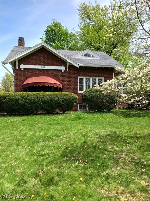 Here is your chance to own a piece of the past mixed with modern updates. This 3BD brick century home is on a corner lot in an old historic neighborhood. The front of the home boasts a brick porch and a generous sized yard with flowering trees while the back has a stone patio with a covered porch and 2nd lot. There are modern updates such as soft close cabinets and stainless-steel appliances in the kitchen, with unique features of old -like the milk door on the porch and humidifiers above warm air registers. The main floor has a large LR and DR w/ beautiful natural trim, a bonus room with a fireplace and tons of natural lighting and a ceramic tiled mudroom off of the kitchen. Upstairs you will find 3 BR all with unique closets and storage spaces, as well as the main bath. There is a full basement with a 1/4 bath and more storage. Don't miss your chance to have the best of two worlds! Schedule your private showing today!!