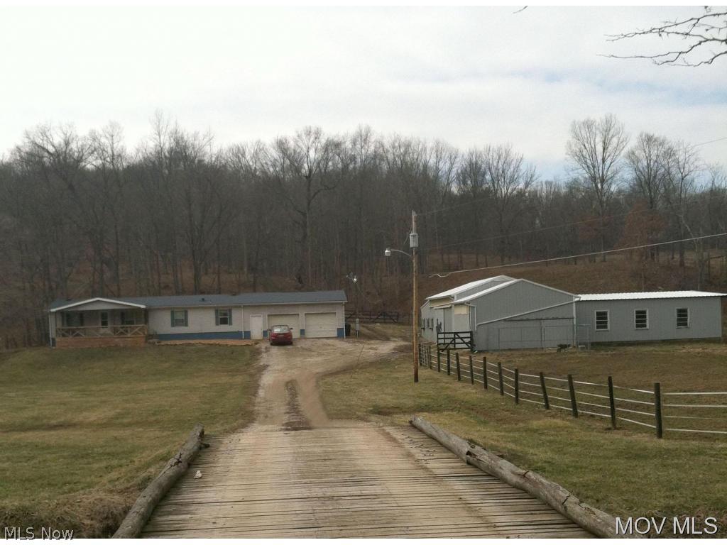 200 amp breaker split: 100 for house & 100 for barn - 24x32 Barn/Stable. Five 12x12 stalls, One 12x8 stall, indoor arena,tack room, fenced pasture &storage building. Each stall has electric outlets and barn has cistern rain fed and has never run dry.SELLER OFFERING HOME WARRANTY! Children get school bus at the end of the driveway. Elem: Barlow-Vincent Elementary Scho Elem/Bus: Y JrHigh: Barlow Vincent JrHigh/Bus: Y High: Warren High School High/Bus: N Fire: VOL Police: SHF PossFreeGas: N ;SQFT=Fin L1:1196, Fin Above:1196, Fin Total:1196, Unfin Bsmt:1196, Unfin Above:1196;GAR= 2 Car Att, Heated;PRKG= Off Street, RV Parking
