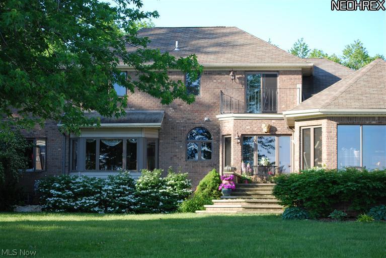 A great value price firm. A vacation everyday on the waterfront with over 100 ft of natural North Coast Shoreline. This home built in 1992 in a perfect location is on a little over an acre at 101x458. View from house and yard of beautiful Lake Erie, Edgewater Park Beach, Perkins Piers, Cleveland City Skyline, sunrise, sunset, boats and birds. As beautiful at night as in daylight and in every season, plus you can see 50 miles out of unobstructed magnificent water vistas. All brick 4 bed 4.5 baths, dark cherry cabinets, marble two story foyer and vaulted ceiling library, first floor bed/bath, tons of storage. New roof as of September 30, 2011. 2500 sq. ft. first floor, 1700 sq. ft. second floor and 2500 sq. ft. lower level. Lower level with mirrored walled exercise room, full bath, 5th bedroom or office, entrance to outdoors from lower level. Best views and location in the city. 9 year old High efficiency Gas furnace home is well insulated and low E glass windows and extra insul