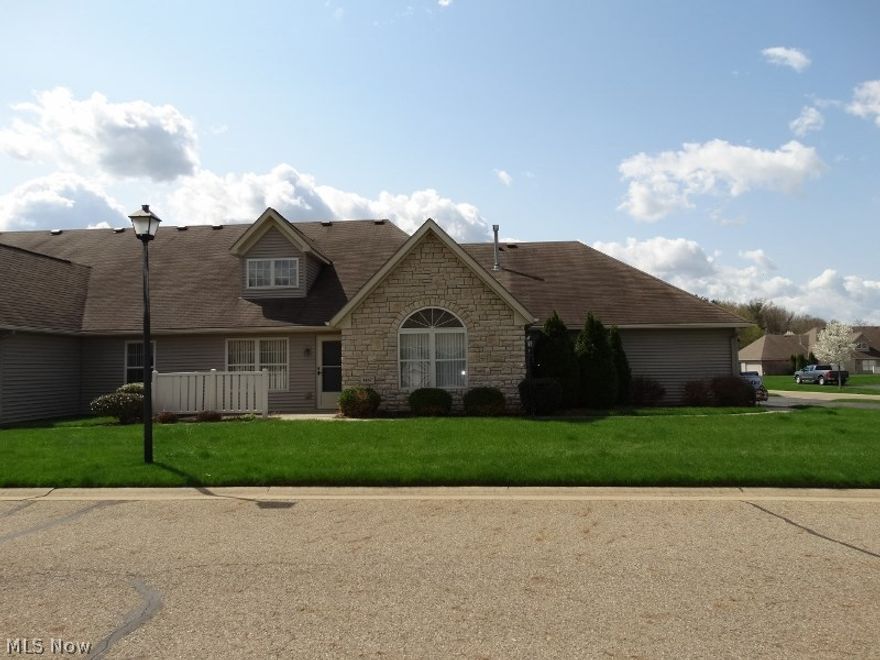 Immaculate two bedroom two bath condo. Newer floor coverings throughout. Oak kitchen cabinets and appliances remain. Attractive lighting over breakfast  bar. Bar stools remain. Patio area. Two car garage plus extra parking. Call today to view.