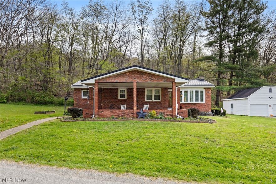 Welcome to 55291 Town Hill Rd Jacobsburg Ohio. This charming all brick ranch offers 3 bedrooms, one being the master with a newly updated master bath, a comfortable living room with tons of natural light and an eat in kitchen. The main bathroom has also been recently updated. Additional updates include a new roof and all new windows. A partially finished basement provides extra living space and flexibility. Enjoy relaxing on the covered front porch or back deck while overlooking a peaceful 0.88 acre lot. Property includes a large detached 2 car garage and additional shed/barn is located across the road for additional outdoor storage needs. Quiet location with room to enjoy both inside and out! Schedule your showing today!