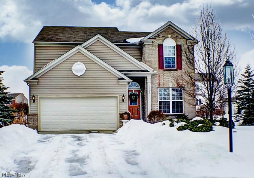 Welcome to Calls Farm and this former model home located on a desirable cul-de-sac.  The open floor plan is designed for today's lifestyle.  The vaulted family room has a corner gas fireplace and opens to the kitchen and eating area.  The kitchen has upgraded cabinets, recessed lighting, hardwood flooring, center island, Corian counters and stainless steel appliances.  In addition to the kitchen dinette there is a formal dining room or home office option.  Upstairs are the bedrooms including the master suite with private bath and huge walk-in closet.  Windows have low E film.  The lower level is finished into a large recreation room area with laminate flooring and a separate area with built-in bookcases that could also be a home office.  The lower level is rough plumbed for a future bath.  Calls Farm amenities include walking paths, access to Metro park bike and hike trail, common green area and playground.  One year home warranty included. Close to schools, parks, golf course, shoppin