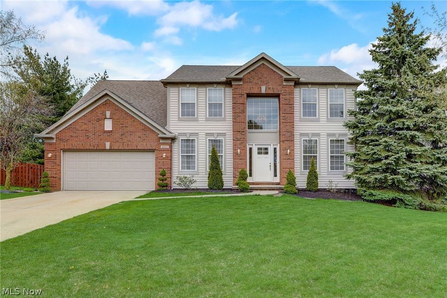 Introducing this elegant colonial home, boasting 4 bedrooms, 2 full baths, and 2 half baths, complete with an attached 2-car garage. Step inside to discover the main floor's inviting layout, featuring a spacious living room, formal dining room, and an open-concept eat-in kitchen seamlessly flowing into the family room. The family room is adorned with a cozy fireplace and offers sliding glass door access off the eat-in kitchen to the expansive back deck and yard, perfect for indoor-outdoor living and entertaining. Ascend to the second floor to find all four bedrooms, including the luxurious primary suite with a private bath and a generously sized closet. A second full bath off the hall ensures convenience and comfort for all. The basement is a versatile space, offering a finished rec room ideal for a playroom, home gym, or entertainment area, complete with a convenient half bath. This home offers the perfect blend of charm, functionality, and comfort, making it an ideal retreat for modern living. Updates include: 2 y/o a/c & furnace, new garage door, roof appx 6 y/o, siding 2024.