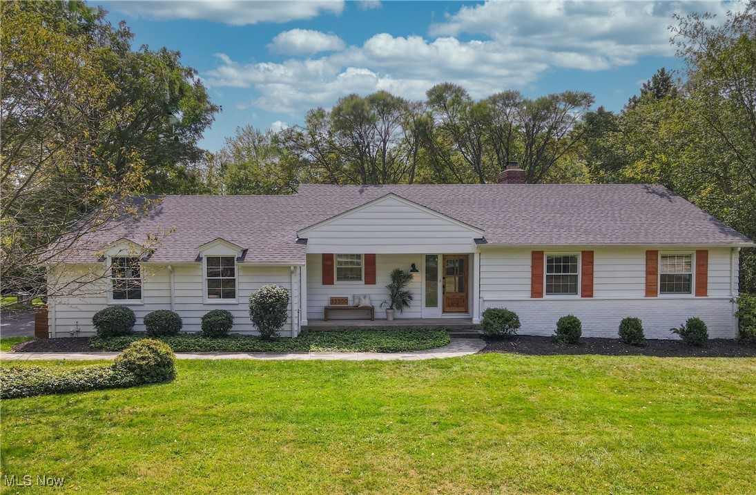 Welcome to this beautifully reimagined ranch in the heart of Pepper Pike, where timeless design meets modern comfort on a lush 1-acre lot. A striking dormer and roof redesign with a buildout of the front entryway, new front door, shutters, and freshly sealed driveway with stone pathways create instant curb appeal. Step inside to a warm and inviting entryway that flows seamlessly into the spacious living room. The thoughtfully remodeled kitchen blends style and function with Quartz premium counters, white shaker soft-close cabinetry, gray glass tile backsplash, a new Viking stove/oven, range hood, appliances, and updated tiling—providing a modern touch while maintaining efficient use of space. Just beyond, the sunroom offers a bright retreat with a newly added doorway to the side yard for easy access outdoors, and updated window coverings. The bedroom wing features refreshed lighting, new window treatments, and freshly painted rooms. On the lower level, the expansive living space includes a refreshed kitchenette with new paint and fixtures, a wet bar with appliances and cabinetry, a sitting area, media room, full bath, and newly finished office and studio spaces for flexibility and comfort. Outdoors, a walkout leads to a beautifully designed patio with a built-in grill, hot tub installation with cement pad and electrical, and a fully fenced backyard with new landscaping and painted shed—perfect for entertaining or quiet relaxation. Additional upgrades include new attic fans, updated fixtures throughout the entry, dining room, and hallways, and enhanced exterior lighting, ensuring every detail has been carefully considered. Located in top-of-the-line Orange Schools, just steps away from restaurants, shopping, parks, and highway access. Schedule a showing today!