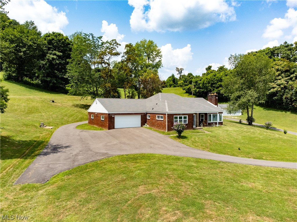 Beautiful and well maintained home, situated on over 52 acres. Main floor owner's suite, 3 baths total, 3 additional bedrooms on the second floor. Updated kitchen (appliances included), Simington windows (2009), roof replaced 2022 (50 year warranty on shingles), and geo-thermo system (April 2023). French Drains and 2 sump pumps installed along with a new septic system (installed 2012). 2 car attached garage, 2 car detached garage. The room identified as "other" is a second floor huge walk-in attic. Eat-in kitchen, dining room, large living room featuring a stone fireplace. Huge living room window offering view of the privacy, and glimpses of the Ohio River, with better views in the winter months.