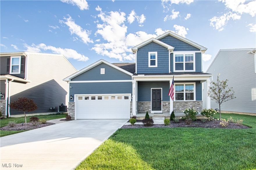 Built in 2023, this exceptional 3-bedroom, 2.5-bath Colonial offers over 2,100 sq. ft. of beautifully designed living space, combining comfort, style, and thoughtful upgrades throughout. The inviting open-concept main floor features a spacious great room flowing seamlessly into a modern kitchen complete with quartz countertops, a large center island, breakfast bar, and ample cabinet space—perfect for entertaining or everyday living. Upstairs, you’ll find three generous bedrooms, including a peaceful primary suite with private ensuite bath, plus the convenience of a second-floor laundry room with sink. The full unfinished basement provides plenty of room for storage or future expansion. Step outside and enjoy the incredible outdoor living spaces, including a custom stamped concrete patio and sidewalk with limestone-capped wall, surrounded by professionally landscaped mulch beds and enhanced with outdoor lighting in the front and on the back patio. Relax under the gazebo with lighting and ceiling fan or gather around the gas fire pit —all perfect for entertaining. The sprinkler system keeps the lawn lush all season long. Additional highlights include a fully drywalled and painted garage with 240V outlet for EV charging. Located in the Columbia Local School District, this move-in ready home is just minutes from shopping, dining, and major highways—offering the ideal blend of modern living and small-town charm.