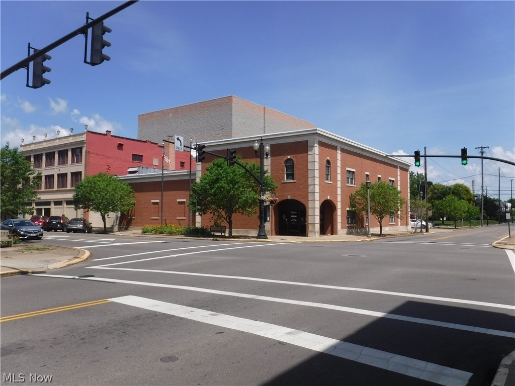 Coshocton, Main Street corner lot, Commercial Building and Land For Sale. Built in 1986, this attractive 2 story building houses over 11,000 sq. ft. of office space and warehouse. Loading dock to 3400 sq. ft of warehouse and street level, front and back entrance to 8000 sq. ft office/retail space. Private 15-20 parking space in rear, off 6th St plus alley. Local 4 lane access 30 minutes from I-77 and I-70, Akron-Canton, Cleveland,Wheeling,Columbus, Pittsburgh. Building sells As Is.