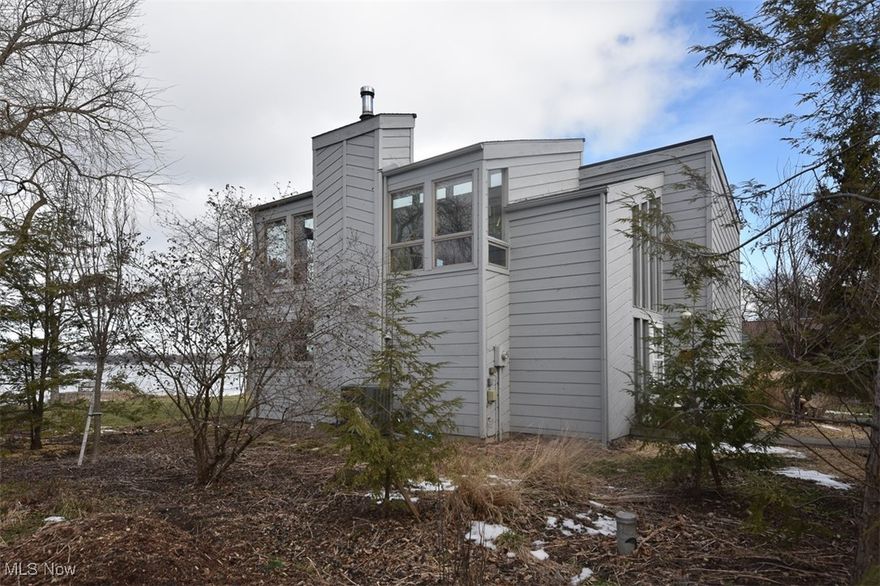 Johnson’s Island Waterfront Home on Sandusky Bay! 1572 sq. ft 2 story home and 28x40 detached garage! Custom home designed to maximize the captivating views of Sandusky Bay with the primary living quarters on the second floor with unobstructed sightlines across the water from the great room, walls of windows, kitchen area, and balcony for the sunsets!  Open floor plan with light & bright neutral décor. Great room w/volume ceiling, wood burning stove, built-in window storage benches, and slider to balcony.  Custom kitchen with loads of counter space and all appliances. Primary suite up and two bedrooms on the main floor with family room to patio area. 1st floor laundry room. Updates include Train Furnace and heat pump 2018, Arzel HeatPumPro 2018, roof on home and garage 2013, 28x40 garage 1994, survey 2022.  Johnson’s Island is accessible via causeway bridge in a gated historical community and an awesome location near Vacationland’s attractions. Joining the Homeowners Association is optional. Call Agent for gate code and schedule a showing today!  See also MLS #5103899 & 5103921.