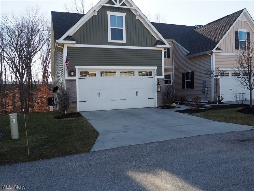 Much has been added to this lovely 4 bedroom, 3 1/2 bath Townhome since it was built. It sets on a quiet private drive close to extra parking for guests. The first floor has all you need with a great room that offers formal dining, a comfortable living room with a beautiful view of a Nature Preserve, a kitchen sitting area and a master suite with a large bath and walk-in closet. Ceiling fans in all the bedrooms add to your comfort. A first floor laundry. Your guests will be charmed when entertaining on the 12 x 20 deck overlooking the scenic winding stream and Nature Preserve or on the 12 x 24 patio with stamped colored concrete easily accessed from the finished lower level walk-out. A full second kitchen on this level makes entertaining inside and outside a pleasure. It can also serve as a workout room, man cave or an amenity rich guest suite. Topsoil was added to the side and back yard along with a front and back sprinkler system to help maintain a healthy lawn. With a low $100 a mon