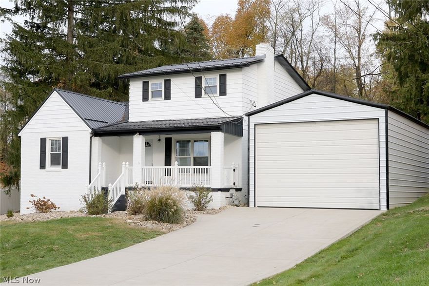 Beautifully remodeled home inside and out. Drive up the new cement drive way and into the brand new huge garage (18' wide x 41'deep) featuring an 11' high automatic door.  This garage holds up to 4 cars on the new cement pad it sits on.  The outside of the home has new roof, gutters and downspouts, soffit and fascia.   New landscaping all around gives this home some serious curb appeal.   Walk inside to all new plumbing, all new electrical, hot water tank, gas furnace and A/C... did I mention these are all new?   Continue with new interior and exterior doors, hardware (including flooring and light) and paint. New molding throughout the interior. Remodeled both bathrooms on first and second floor.  Brand new kitchen cabinets and granite countertops, stainless steel stove, refrigerator, microwave and dishwasher make this home move in ready.  Second floor offers an unfinished bonus room perfect for storage.  The basement was completely remodeled with new flooring, added a full bathroom, t