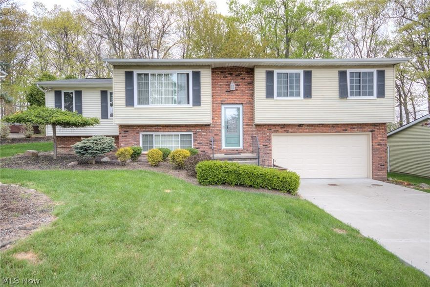 A Must See!  This bi-level split in Vienna Woods offers a very open floor plan including a Family Room Addition w/vaulted ceilings, built in shelving, double window seats and recessed lighting. There are 3 large bedrooms and 2 full baths. The 2nd level bath is remodeled with ceramic tile flooring and shower surround plus granite counter tops.  The lower level also offers 3 large finished rooms perfect for exercise area, office or playroom. The home features a spacious kitchen with laminate wood floors and plenty of cabinet space and comes with all appliances. Neutrally painted and carpeted, this home is move in ready for any buyer. The beautiful wooded view can be enjoyed off the large deck or from both the kitchen and family room. Newly insulated (2015) New Windows (2014) Electrical box w/200 amp service (2010) Wood burner and Garage Door (2009). This home is priced to sell and will not last long!