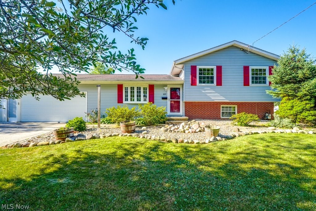 Beautiful home in Munroe Falls! This 3-bedroom 2 full bath home is freshly painted and ready for you! As you enter the home you will notice the spacious living room and dining area with beautiful hardwood floors. The dining area has sliding doors to the back yard. The kitchen has newer appliances, and they will all stay. The upstairs has 3 spacious bedrooms with hardwood wood floors. The master bedroom has an updated ensuite bath. The main bath has been beautifully updated as well. The lower level has a 11x22 family room. The unfinished area of the basement contains the laundry area. There is a door that walks out to the back yard for your convenience. The fenced backyard area is private and very relaxing. The gazebo, fire pit and outdoor sofa will stay. The 2-car garage is attached is freshly painted. The windows have all been replaced. The furnace and air conditioning, and hot water tank have been updated 2022. Roof 2014. Home warranty provided by the sellers.