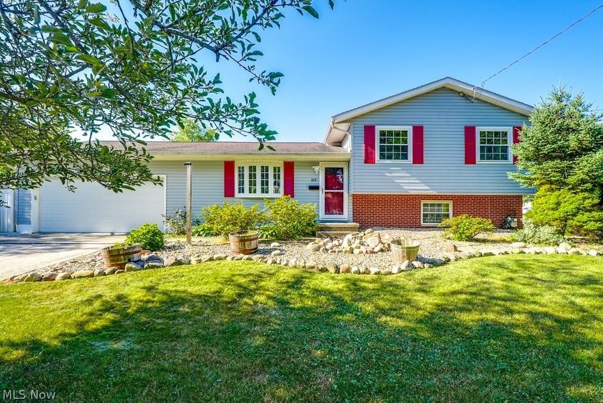 Beautiful home in Munroe Falls! This 3-bedroom 2 full bath home is freshly painted and ready for you! As you enter the home you will notice the spacious living room and dining area with beautiful hardwood floors. The dining area has sliding doors to the back yard. The kitchen has newer appliances, and they will all stay. The upstairs has 3 spacious bedrooms with hardwood wood floors. The master bedroom has an updated ensuite bath. The main bath has been beautifully updated as well. The lower level has a 11x22 family room. The unfinished area of the basement contains the laundry area. There is a door that walks out to the back yard for your convenience. The fenced backyard area is private and very relaxing. The gazebo, fire pit and outdoor sofa will stay. The 2-car garage is attached is freshly painted. The windows have all been replaced. The furnace and air conditioning, and hot water tank have been updated 2022. Roof 2014. Home warranty provided by the sellers.
