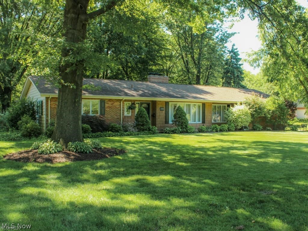 Look no further Ranch buyers! This is the one you have been waiting for. Totally custom and undated Ranch in beautiful Silver Lake Ohio. This well cared for home is loaded with charm and character that starts on the outside. The extensive list of upgrades includes the professionally landscaped yard with a beautiful covered patio and outdoor sitting room to have your morning coffee. There is a custom made barn in the yard wired with electric, an electric underground dog fence, underground utilities and irrigation well. Newer water softener. This home also features an open family room connected to a custom cherry cabinet kitchen and gorgeous entertainment center with Bose audio system throughout the kitchen and family room. Beautiful hardwood flooring, 3 fireplaces, two with custom made mantels. Awesome updated main bath with whirlpool tub and glass surround shower. Ceiling fans throughout. One bedroom converted to "closetmade" walk in closet and another with built in ceiling t