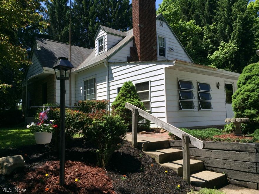 Charming Country Cape Cod on 1.9 acres of wooded land for plenty of privacy with a built-in outdoor gas grill for tons of outdoor fun located in the Green Local School District.  This quaint 3 bedroom & 1 bath home is fully insulated with upgraded double hung tilt-in windows, an enclosed screen porch & is within walking distance to Comet Lake.  A two car detached & an additional one car detached garage provide plenty of storage space.  This home is a must see to truly appreciate!