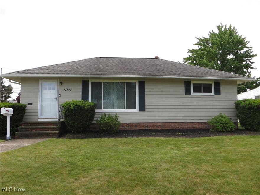 Looking for a home that’s not too big?  Looking for a home that’s not too small?  11141 Schwab Drive may be the one that is “just right.”  Come take a look!   This well-maintained ranch-style home is located near Parma’s southern border.  Exterior updates include all windows (2018/19) and front and side entry doors (2017).  Enter through the front door and enjoy the dining room, living room combination which provides an open feel to the main living space.   Recently refreshed with paint, the neutral tone is complimented by natural light shining through the picture window.  Hardwood flooring begins here and continues into all three bedrooms.  The quaint kitchen can accommodate a small breakfast table but currently is enhanced with movable cabinetry which will remain with the home.  There was once access from the kitchen to bedroom three, but the access has been sealed.  The master bedroom is nicely sized, cooled by a ceiling fan and has new window blinds.  Attic access is found in the closet.  Bedroom two features a ceiling fan and new window blinds.  Bedroom three has been freshly painted and features a ceiling fan.  The bath is bright and has been refreshed.  Additional living space can be found in the lower level.  Wainscoting accents the walls.  Vented glass block windows were installed in 2018/19.  The washer and gas dryer are less than five years old.  There is also an electric dryer hook-up.  Plenty of room for your storage needs.  The basement freezer remains.   Enjoy the dog-days of summer relaxing on the deck built in 2024.  The backyard fence, installed in 2017, adds piece of mind - keeping what needs to be inside in – and what should remain outside, out!  The play-set remains.  The mulched area behind the garage was once home to a trampoline.  And speaking of the garage, the spacious two-car garage has a work bench perfect for the do-it-yourselfer!  The air conditioning unit is two years old.  Ring doorbells and outside security cameras remain.