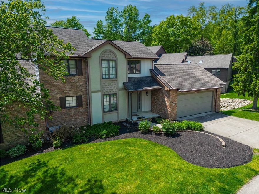 Waterfront condo backing to a scenic pond with fountain + rare walk-out  lower level! This 2 bed, 2.5 bath home offers a bright, open layout with soaring ceilings, skylights, and a cozy fireplace anchoring the living room. Large windows flood the space with natural light while showcasing peaceful pond views. The main level features convenient first-floor laundry and access to a low-maintenance Trex deck overlooking the water and fountain - perfect for relaxing or entertaining. Upstairs, you'll find a spacious primary suite along with an additional bedroom and full bath. The fully finished walk-out basement expands your living space with a second kitchen setup, full bathroom, and opens to a private lower patio just steps from the pond - ideal for guests, entertaining, or multi-generational living. A rare opportunity combining flexible space with tranquil waterfront views!