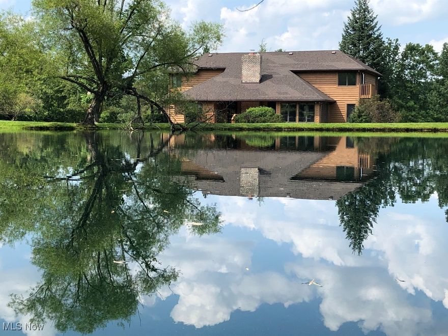 Stunning Architect Designed Custom Built 5 Bedrm Home (See videos attached) situated on just under 10 breathtaking acres in desirable Montville Township. A RARE OPPORTUNITY for a PRIVATE ESTATE close to Medina with great I-71/271/18 access w/PUBLIC WATER and NO CITY TAX!   Two owners since new and meticulously maintained.  This Custom Home offers * Great Room w/Cathedral Ceiling, Luxury Insert Fireplace *Custom solid wood cherry cabinets throughout *2 Story Foyer flanked by the clean lines of an open staircase *Living Rm/Morning Rm *Formal Dining Rm *Large Custom Eat-In Kitchen opens to the Great Rm *Butler's Pantry/Mudrm *1st FLR Laundry *Huge Private Primary Suite with adjoining Sun Rm, Bath with Garden Soaking Tub and Separate Shower and a Huge Walk-in Closet with Built IN *The 1st FLR is completed by an additional Bedroom and Guest Ba *Upstairs 3 additional Spacious Bedrms with Large Full Ba *Quality 2 x 6 Construction *Natural Gas Heat *Huge 2,260 sq. ft unfinished Basement fully plumbed, for work space, storage or finish for potential 5,557 sq. ft Living Space *Freshly Stained House/Barn *Roof ('17) *HWT ('17) *AC ('22) *Newer Garage Door/Andersen Exterior Doors *Washer/Dryer ('24) *Cooktop ('25) *Newer Furnace/High-end Stainless Steel Appliances *Beautiful Stocked Pond *Custom 40 x 42 Barn ('15) - w/Concrete Floor & Full Electric *Apple/Pear Orchard *Large Entertainment Deck *Split Rail Fencing *Full Property Access by maintained Walking Trail