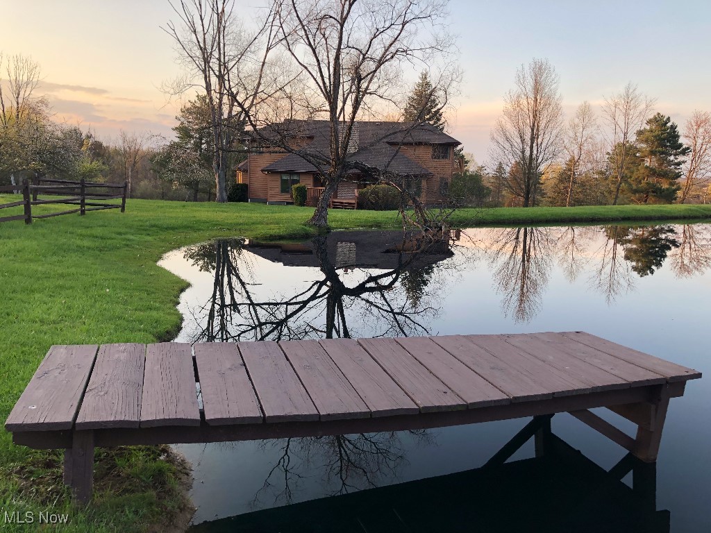 Stunning Architect Designed Custom Built 5 Bedrm Home (See property videos attached) situated on just under 10 breathtaking acres in desirable Montville Township. A RARE OPPORTUNITY for a PRIVATE RETREAT close to Medina with great I-71/271/Rt 18 access w/PUBLIC WATER and NO CITY TAX! Two owners since new and meticulously maintained. This 3,297 sq. ft Custom Home offers * Great Rm with Cathedral Ceiling, Wood Burning Luxury Insert Fireplace* Custom solid wood cherry cabinets throughout* 2 Story Foyer flanked by the clean lines of an open staircase *Living Rm/Morning Rm *Formal Dining Rm *Large Custom Eat-In Kitchen opens to the Great Rm *Butler's Pantry/Mudrm *1st FLR Laundry * Huge Private Primary Suite with adjoining Sun Rm, Bath with Garden Soaking Tub and Separate Shower and a Huge Walk-in Closet with Built IN *The 1st FLR is completed by an additional Bedroom and Guest Ba *Upstairs 3 additional Spacious Bedrms with Large Full Ba *Quality 2 x 6 Construction *Huge 2,260 sq. ft unfinished Basement fully plumbed, for work space, storage or finish for potential 5,557 sq. ft Living Space *Roof (2017) *HWT (2017) *AC (2022) *Newer Garage Door & Andersen Exterior Doors *Washer/Dryer (2024) *Newer Furnace - High-end Stainless Steel Appliances *Beautiful Stocked Pond *Custom 40 x 42 Barn (2015) - 1,680 sq. ft w/Concrete Floor and Full Electric - Home Business/Up to 8 Cars *Apple/Pear Orchard *Large Entertainment Deck *Full Property Access by maintained Walking/Bridle Trail.