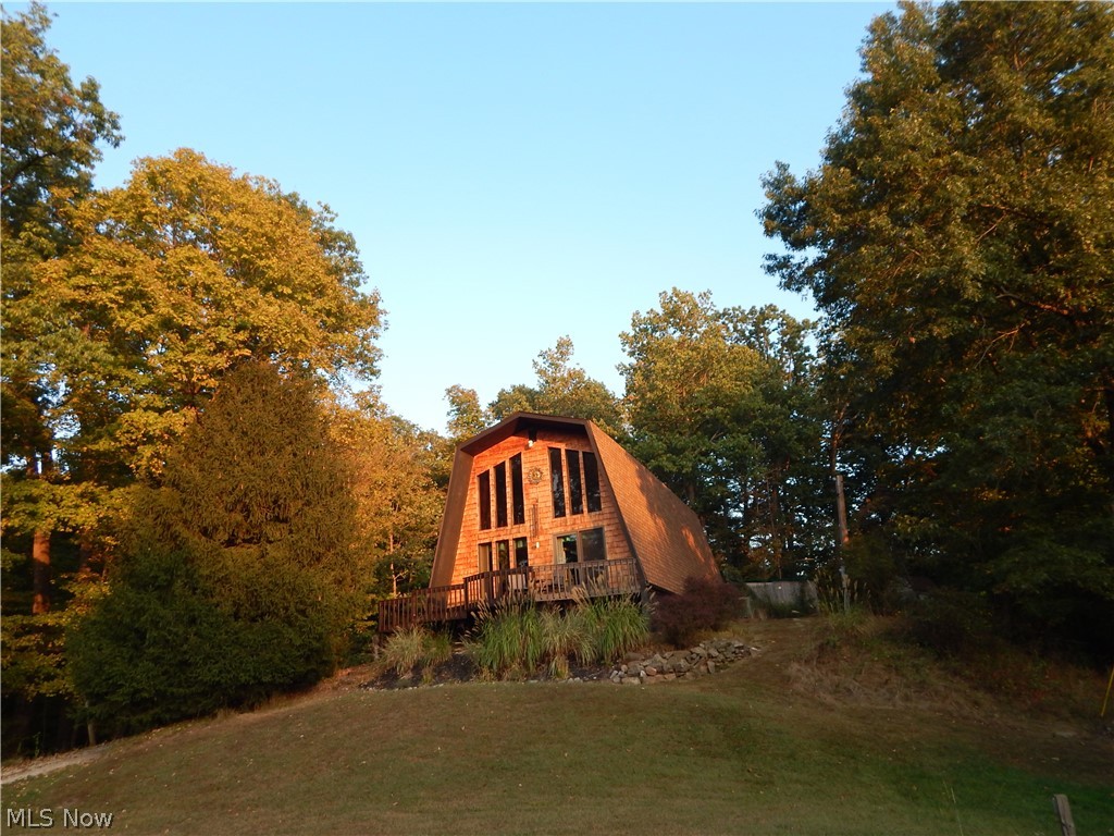 WATCH SEASONS CHANGE ON KELLER LANE!
This hidden & beautiful cedar sided 2 bedroom, 2 full bath home on 2.51+/- acres has an open floor plan & spacious rooms. The sturdy wood beamed staircase, wood trim and cozy wood burning fireplace with stone trim gives it a warm, cabin feel! There are lots of windows, allowing you to have views for miles from most areas in the home. Step out onto the front deck for a cup of coffee & take in the peaceful wooded setting that surrounds you! Upstairs, the master suite is complete with a full bath and even an office area! You'll never know you are just minutes from the conveniences of Parkersburg & Marietta! Call for details!