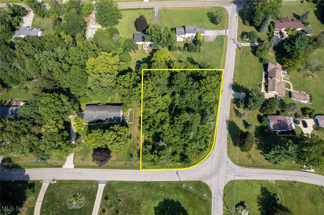 Build your dream home on this wooded lot in an established neighborhood in Sagamore Hills! Great location between Holzhauer and S. Boyden near shopping & conveniences, but also close proximity to CVNRA and hike& bike trail! Lot is 29,242SF per tax record -- frontage is less than rear line due to corner turnout. Rear line is 177.84 wide. See plat.