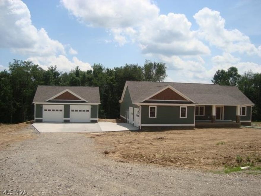 New Construction with beautiful stone and vinyl, 3Br, 2FB, first floor laundry. hardwood floors, 2 car attached and large detached garage.