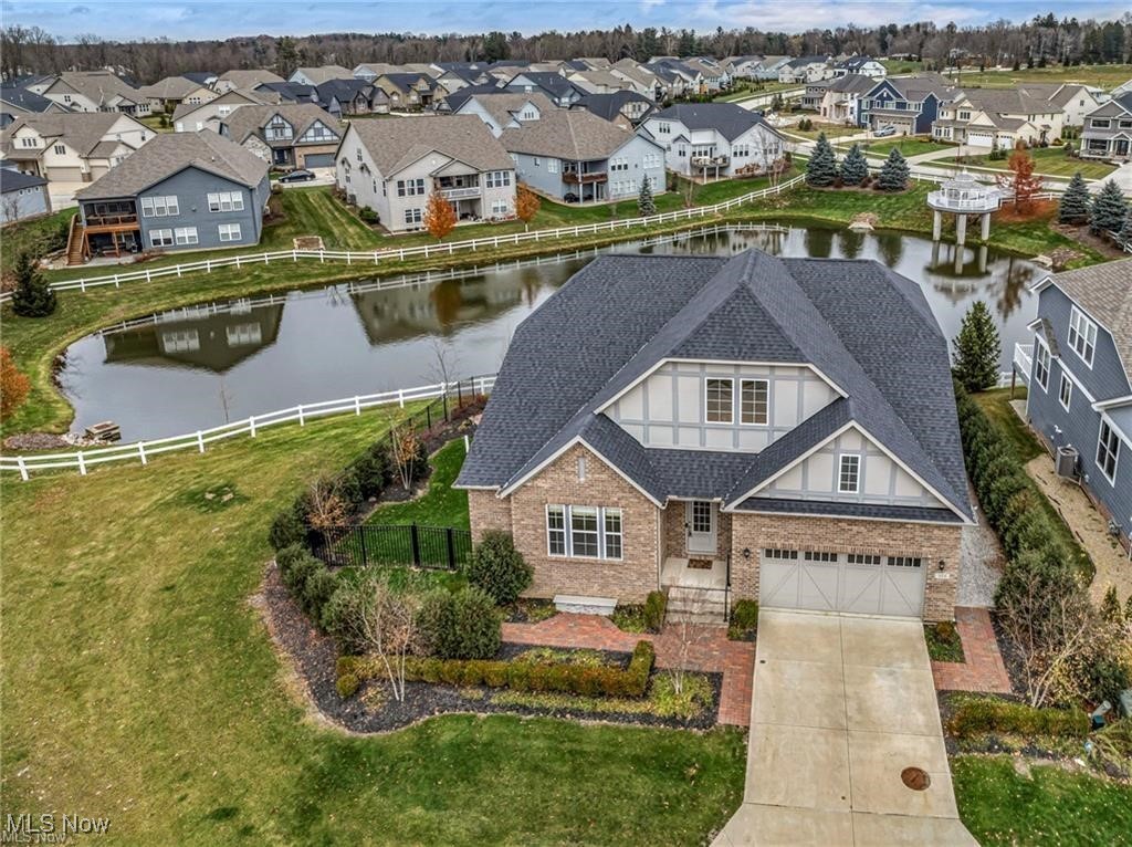 THE ONE has arrived to The Lakes of Orange. Located on the #1 best & uniquely located parcel in the highly coveted “Lakes of Orange” community, this stunning recently built (2019) home can be your new lakefront oasis. Featuring sweeping panoramic majestic views of the beautiful lake w/gazebo and privately nestled against the woods, this tranquil and serene home will make you think you are in a cabin in the mountains of Lake Tahoe. This home offers outstanding and unparalleled indoor and outdoor entertainment opportunities. It's truly a one-of-a-kind property designed to capitalize on beautiful surroundings and nature. Modern, elegant, and sophisticated, this recently custom built (2019) gem is nearly 6,000 total sq ft (3300 above sq ft, 2500 below grade), features a grand two story foyer, dedicated dining room, and open concept great room and deck w/unmatched panoramic views overlooking the lake. Other features include hardwood floors, large island, subzero refrigerator, quartz countertops, butler's pantry w/beverage center, high vaulted ceilings, and tons of natural sunlight. Private Trex deck w/staircase to large patio perfect for 2 levels of outdoor entertaining! 1st Floor master suite featuring spa-like master ensuite-bath and lake views. 2nd bedroom/full ensuite-bath also located on the main level. Also a formal dedicated dining room, laundry room, mud room, & recently refreshed half bath powder room on the 1st floor. 2nd level features 1 additional bedroom, large recreational loft living area, & full bath. Lower level features 9 foot ceilings (Egress garden windows w/ lake views) and is plumbed for a full bath. Potential to add another bedroom & full walkout basement. Other upgrades include: Hunter Douglas remote window treatments, landscaping, exterior/patio light system, irrigation system, new fence & more. Enjoy the neighborhood community amenities: pool, tennis court, and clubhouse! Orange School District! Call 355 Tahoe Trail “HOME” Today!