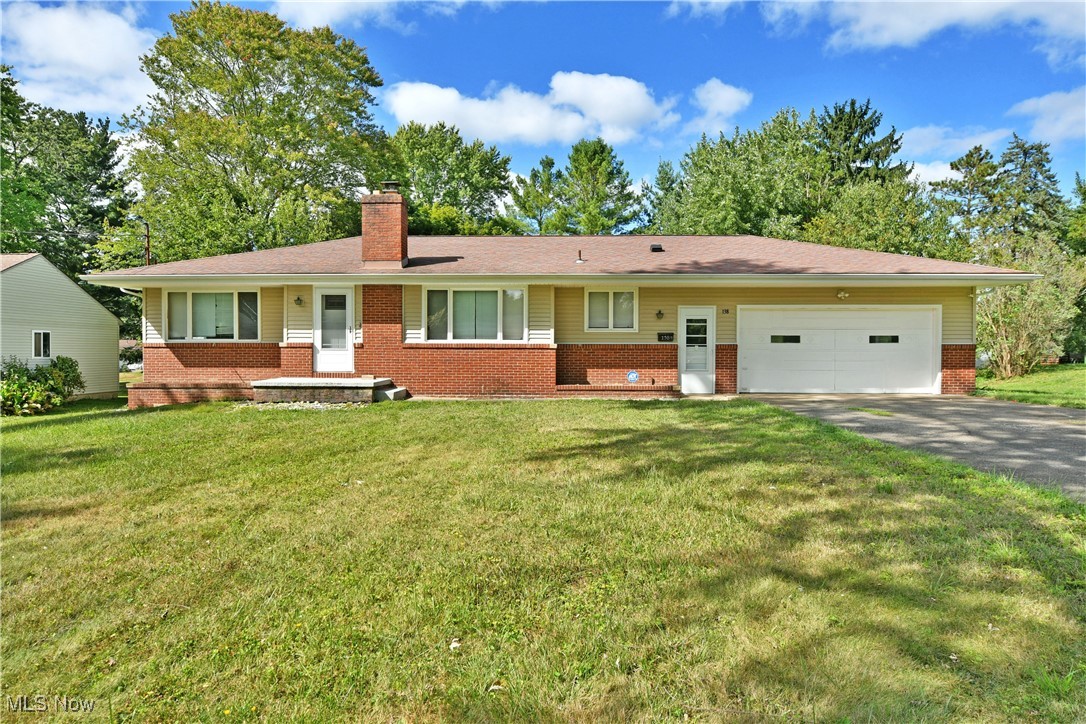Make your move in style as you’re first through the door of this colorful and comfortable Niles ranch in Howland School District! Showcasing its desirable, three-bedroom layout while located in an advantageous neighborhood, close to local shopping, dining, and attractions alike, this home checks all the right boxes. The sizable property begins with a cement drive leading up to the two-car attached garage, while warm brick accents trim the front of the home. A fenced-in backyard offers privacy and security alike as it extends towards the tree-lined backstop. Step inside to find the welcoming living room with its tall windows and hardwood flooring. The brick-lined fireplace helps to divide the central dining room, where you’ll enjoy plenty of natural light and front yard views. A serving window peers into the adjacent kitchen where robust, tiled flooring joins the complimenting backsplash and polished stone countertops. Along the main hall, a trio of spacious bedrooms are divided by a brightly lit full bath and its handsomely tiled shower. The sizable master bedroom offers great closet space along with the two additional bedrooms, with one offering an attached half bathroom. Down below, a full basement brings plenty of storage solutions, laundry services, and a half bath. Updates include bathrooms, electrical box, air conditioning, plumbing in the basement, and siding, all completed in 2019. Plus a one-year home warranty!