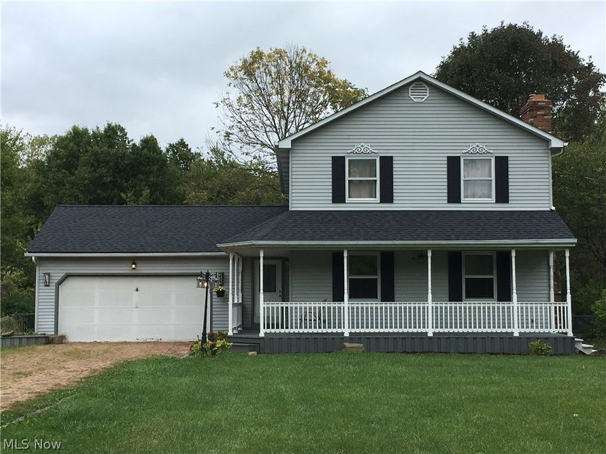 Beautiful 4 bedroom 3-1/2 bath colonial in Lordstown school district. Wood burning fireplace with blower in living room, lot of cabinets and breakfast bar in kitchen, window seat in dining room, first floor laundry opens to deck, first floor half bath.  Master bedroom with private bath, 2 closets.  Home has number of updates: roof, hot water heater, new retaining wall, Tiffany lights, etc.  Walkout basement is mostly finished with full kitchen, bath, bedroom, lot of storage.  Brick drive, fenced backyard, front wrap porch with non-slip finish, deck, firepit, large outbuilding/workshop.