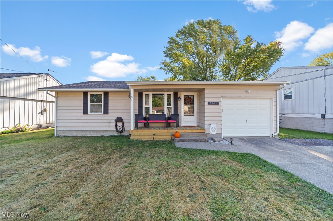 Welcome to 7045 Freeland Drive! Step inside this beautifully updated ranch to find new flooring and modern light fixtures throughout, creating a fresh and inviting feel. The kitchen features crisp white cabinetry and a spacious island with plenty of space for cooking and gathering. All three bedrooms and a full bathroom are conveniently located on the main level. The finished basement provides additional living space, perfect for extra family room, man cave or kids play area! Outside, you'll love the back deck, newer fence, and spacious backyard. The front porch was recently updated and enhances this home's charming curb appeal. Schedule a showing with your favorite realtor today!