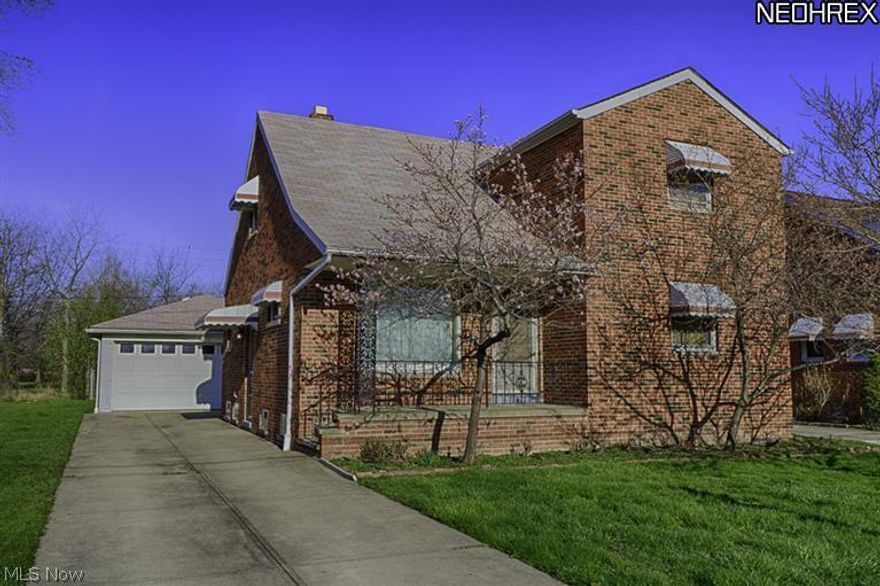 Oversized all BRICK bungalow freshly painted with hardwood floors throughout! 4 bedrooms (2 on main and 2 up) with full bathroom on 1st floor and large 1/2 bathroom on 2nd floor with space to convert to full bath if desired. Full unfinished basement. Lots of OPPORTUNITIES! Bring your decorating ideas and turn this great house into a wonderful home! Quaint front porch and large 2.50 car detached garage, too!