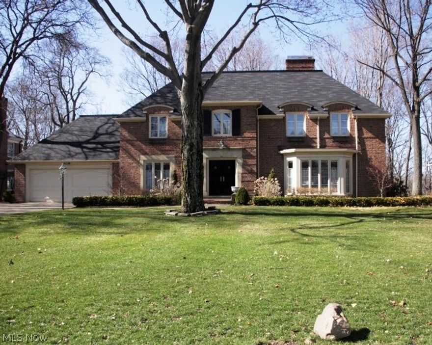 Elegant Brick Center Hall Georgian Colonial on deep valley lot.  Spectacular private setting.  Meticulously maintained with updates throughout. Great circular traffic pattern for easy living. Four large bedrooms.  Three full baths and one half bath.  Updated kitchen with high- end appliances  opens to large family room.  Spacious first floor office.  Hardwood floors, unique fireplaces  .Master suite on second floor with master bath, granite counter and stall shower. Two stairways to finished lower level with full bath provides even more living space.  Second floor laundry with attached dark room. Full walk-up attic for storage or possible expansion. New roof 2013.  Professionally landscaped yard.   Sprinkler system.   A stunning property in a prime location.