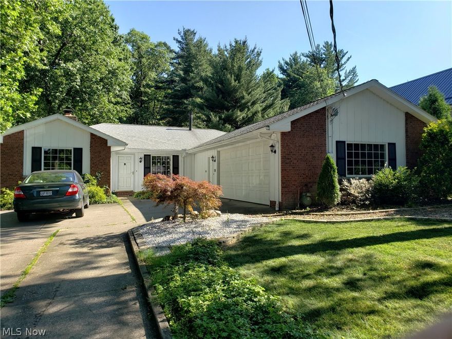 There are not many ranch homes for sale and this one is a
beauty! Recently updated. A beautifully scenic & private back
yard. As soon as you enter this home, a foyer invites you enter into the huge
dining Room. Within the past 2 years, the kitchen
and 2 bathrooms have been remodeled and feature
granite and quartz counter-tops and gorgeous tile work. There is a
wonderful 3 season room to the back of the home with
outstanding park like views and a quiet place to work or ponder.
The updated eat in kitchen features a large center island, an
induction cook-top, microwave and dishwasher - all less than 2
years old. A step down leads to the open concept living room
which shares a cozy see through fireplace with the
dining room. There are 3 carpeted bedrooms and 2 1/2 bathrooms. 
Wait till you see the attached
over-sized 707 square foot 2-car attached garage! It has its own
bathroom! A dream man cave workshop space! Out back, a
stamped concrete patio is privately tucked away. A