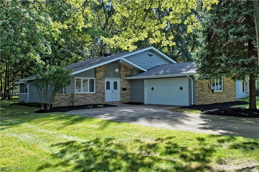 Welcome home to this lovingly maintained Mentor split-level on a lot with a park-like setting. Brand new flooring throughout first floor!! The gorgeous kitchen is perfect for the chef of the family and was just completely remodeled and features vinyl plank flooring and new cabinets and stainless steel appliances. Vaulted ceilings in the Great Room and Dining Room make everything feel that much more expansive. The second story offers three generously sized bedrooms as well as a full bathroom that was renovated just a few years ago. The lower level is has loads of potential with a family room that can become an awesome theater, recreation room or anything else you can imagine along with a half bathroom and unfinished portion that can be used for a workshop, storage and much more. Enjoy the quiet lot in a screened in porch is great for enjoying the beautiful backyard that also has a large shed. Most major mechanicals have been replaced. One year home warranty offered. See this today, it w