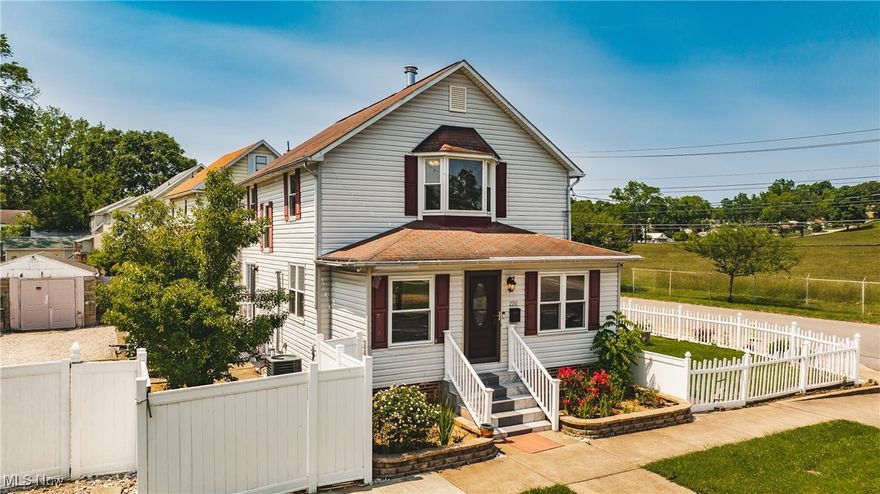 Welcome to this charming two-story conventional-style home offering 4 bedrooms and 2.5 baths, perfectly situated on a desirable corner lot. Nestled on a double lot, the property is partially enclosed by a white vinyl fence, providing privacy and curb appeal.

Step inside to find a spacious layout that has been thoughtfully updated over time, including improvements to the kitchen, flooring, siding, windows, and doors, giving the home a fresh and modern feel while maintaining its classic character.

The full unfinished basement provides ample storage or the opportunity to finish it as additional living space, with both interior and exterior access for added convenience. Enjoy outdoor living on the side deck located just off the dining room—featuring low-maintenance composite decking and vinyl railing, ideal for entertaining or relaxing.

A detached storage building adds even more functionality to the property, making this home a well-rounded package for those seeking space, updates, and versatility.

NEW ROOF AND GUTTERS INSTALLED IN AUGUST 2025 - Home has been Appraised and is listed as to value Appraised.