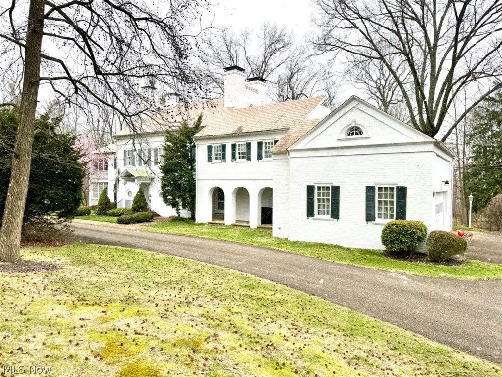 Early Colonial Mansion. 10.83 Acres, 5,000+ Sq. Ft., 5 Bedrooms, 4 Full Baths. Stark County, Alliance City. ABSOLUTE AUCTION, ALL SELLS TO THE HIGHEST BIDDER ON LOCATION. ONLINE BIDDING BEGINS SUNDAY, APRIL 21, 2024 – 12:00 PM AND AUCTION LIVE ON-SITE BIDDING WILL BEGIN WEDNESDAY, APRIL 24, 2024, 12:00 PM. This home has stood the test of time and remains a beautiful landmark in the community. From the soaring castle-like chimney tops to the amazing fireplaces, you will be impressed. You are greeted with a large open front entrance, living room with built-ins and white marble fireplace, 4 seasons sun porch with access to the side courtyard, office/library with hardwood floors, built-ins and wood burning fireplace, half bath, large formal dining room complete with a “Butler Call” buzzer and lighted built-ins, pantry with separate sink and cabinets. Nice main kitchen with stainless steel appliances, rear mudroom entrance that comes with a built-in milk delivery door. Up the beautiful winding staircase is the 2nd floor feat. a master bedroom with carved marble fireplace, large 2-story porch overlooking the side courtyard, full private bath with shower, tub and his & hers dressing rooms. Down the hall you have 2 additional bedrooms both with private full baths. The E side of the upper level was designed for the employees that lived and worked at the mansion, having an office, maids’ storage rooms, 2 additional bedrooms each with a full bath, and access to the wood shop. The lower level was made for entertaining with a coat check room, half bath, tavern with a wet bar, billiards room with 3 stained glass French doors that lead to the Tea Garden and fireplace. The E side of the basement has a utility room, 3 gas FA furnaces with central air, laundry room, triple sink and access to the backyard. The home is mostly brick with a slate roof, attached two-car garage, blacktop horseshoe driveway and a beautiful view of the 10.83 acres with winding creek and loads of wildlife.