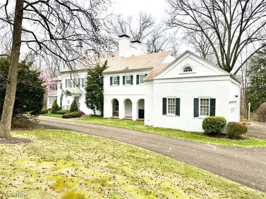 Early Colonial Mansion. 10.83 Acres, 5,000+ Sq. Ft., 5 Bedrooms, 4 Full Baths. Stark County, Alliance City. ABSOLUTE AUCTION, ALL SELLS TO THE HIGHEST BIDDER ON LOCATION. ONLINE BIDDING BEGINS SUNDAY, APRIL 21, 2024 – 12:00 PM AND AUCTION LIVE ON-SITE BIDDING WILL BEGIN WEDNESDAY, APRIL 24, 2024, 12:00 PM. This home has stood the test of time and remains a beautiful landmark in the community. From the soaring castle-like chimney tops to the amazing fireplaces, you will be impressed. You are greeted with a large open front entrance, living room with built-ins and white marble fireplace, 4 seasons sun porch with access to the side courtyard, office/library with hardwood floors, built-ins and wood burning fireplace, half bath, large formal dining room complete with a “Butler Call” buzzer and lighted built-ins, pantry with separate sink and cabinets. Nice main kitchen with stainless steel appliances, rear mudroom entrance that comes with a built-in milk delivery door. Up the beautiful winding staircase is the 2nd floor feat. a master bedroom with carved marble fireplace, large 2-story porch overlooking the side courtyard, full private bath with shower, tub and his & hers dressing rooms. Down the hall you have 2 additional bedrooms both with private full baths. The E side of the upper level was designed for the employees that lived and worked at the mansion, having an office, maids’ storage rooms, 2 additional bedrooms each with a full bath, and access to the wood shop. The lower level was made for entertaining with a coat check room, half bath, tavern with a wet bar, billiards room with 3 stained glass French doors that lead to the Tea Garden and fireplace. The E side of the basement has a utility room, 3 gas FA furnaces with central air, laundry room, triple sink and access to the backyard. The home is mostly brick with a slate roof, attached two-car garage, blacktop horseshoe driveway and a beautiful view of the 10.83 acres with winding creek and loads of wildlife.