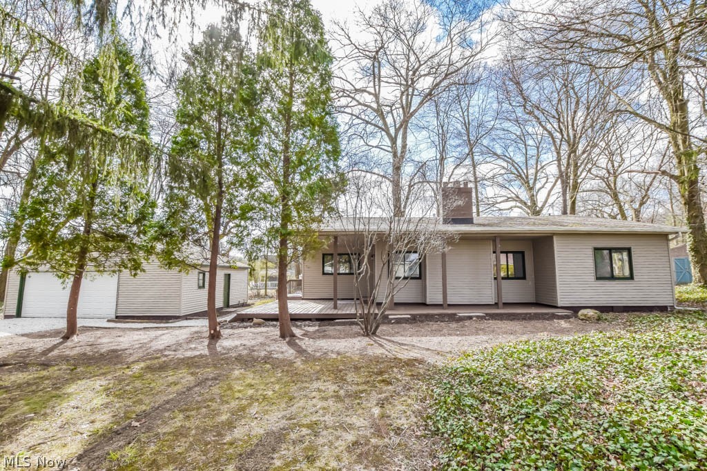 This beautifully remodeled ranch is sure to impress with its stunning makeover and surprisingly spacious layout. From the moment you pull into the freshly graveled drive leading to the oversized two car garage, you'll fall in love with the wooded setting. A large deck invites you inside to the massive great room boasting a beamed vaulted ceiling and cozy wood burning fireplace. New vinyl plank flooring continues into the gorgeous eat-in kitchen accented by granite counters, tile backsplash and stainless steel appliances. Nearby you'll find the laundry room and one of the bedrooms with access to a renovated full bath. The other side of the home features two more bedrooms, another updated full bath plus a bonus room, ideal for a home office. Outside, enjoy the 3/4 acre park like setting with mature trees and a shed. Additional improvements to note are a new furnace and A/C. Don't miss out, call today!