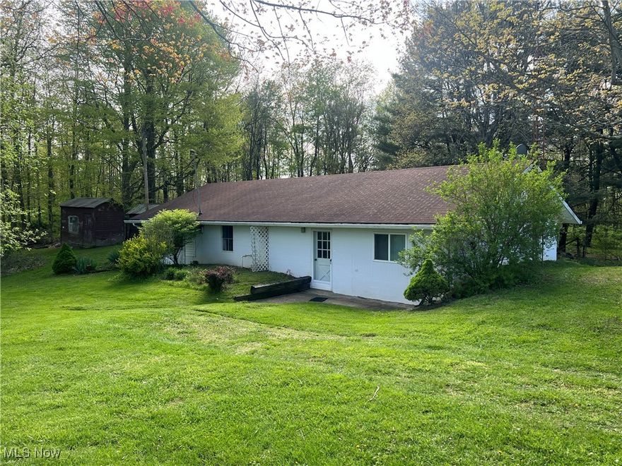Come take a look at this affordable high setting home in the country on 3.5 mostly wooded acres between Millersburg and Killbuck. This ranch style home has oak kitchen cabinets, solid core doors, woodburning stove in large living room with a lot of natural light, natural gas heat stove, tankless water heater, and more. Outside there is a machinery shed and several other sheds and an older mobile home. Also a grape arbor, apple tree, lilac bush, firebush, gooseneck flowers, and mushrooms. Close to HC Airport and Airport Ridge Sporting Clays. Would make a great getaway property or starter home.