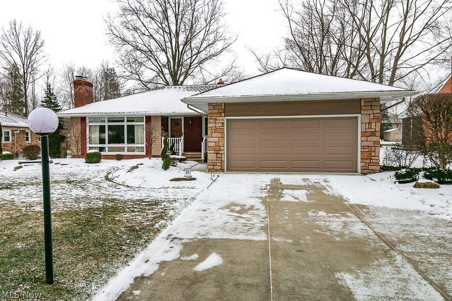 Charming meticulously cared for 1884 sq.ft. ranch in sought after Mayfield Village. As you enter the home you were greeted by a beautiful great room featuring wall of windows and a beautiful, sandstone gas fireplace. Eat-in kitchen with newer luxury vinyl flooring, Corian countertops, built-in appliances, pantry, built-in breakfast nook and an abundance of cabinetry. 3 bedrooms all have oak hardwood floors under the carpeting. Nice master suite with private bathroom. Sunken family room off the back of the home that walks out to the covered porch with 2 decks, built in gas grill and walks out to the beautiful backyard with perennials and storage shed. Full basement with finished recreation room offering a wood burning fireplace and a fantastic built-in wet bar. Great for entertaining. The lower level also features a huge storage room with built-in workshop and access stairwell to the 2 car garage with nature stone flooring. Other updates over the years include: Roof 2008, HVAC 2010, And