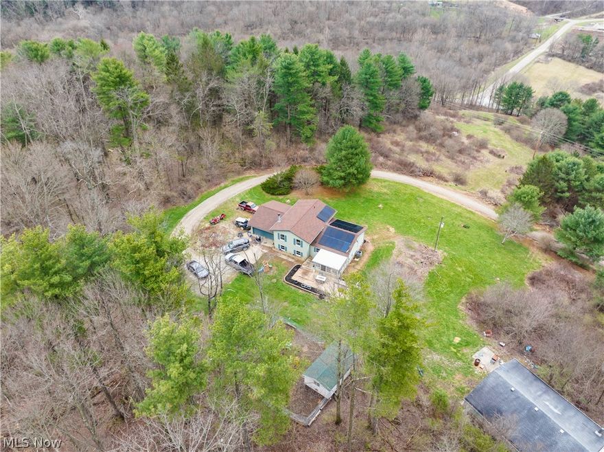 Located in Coshocton County, Ohio, this 10.05-acre property features a 2,804 square foot home with four bedrooms and three full bathrooms. The layout provides space for guests or a growing household. The home is all electric with no gas or propane service.

Recent updates include new flooring throughout, a new roof in 2023, a new roof on the sunroom in 2026, and a new water softener and reverse osmosis system installed in 2022. Solar panels were installed in 2023 and include a warranty. The driveway has been resurfaced.

The property includes a garage and a 30 by 40 pole barn with concrete floors, providing additional storage or workspace.

The property directly borders Woodbury Wildlife Area, offering access to approximately 30,000 acres of public land for outdoor recreation including hunting, fishing, and hiking