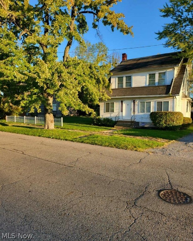 This large two story is waiting for you! Through the front door you have an AWESOME entertaining space with bar area! The first floor includes a large living room, dining and galley style kitchen all with 10 foot ceilings throughout. There is an additional covered three seasons room off the back of the house. The upstairs includes three generously sized bedrooms and a nice sized bathroom. The home features a HUGE attic space that could be a fourth bedroom or extra living space! So much space to make it your own! Furnace new in 2019, HWT about 10 years.