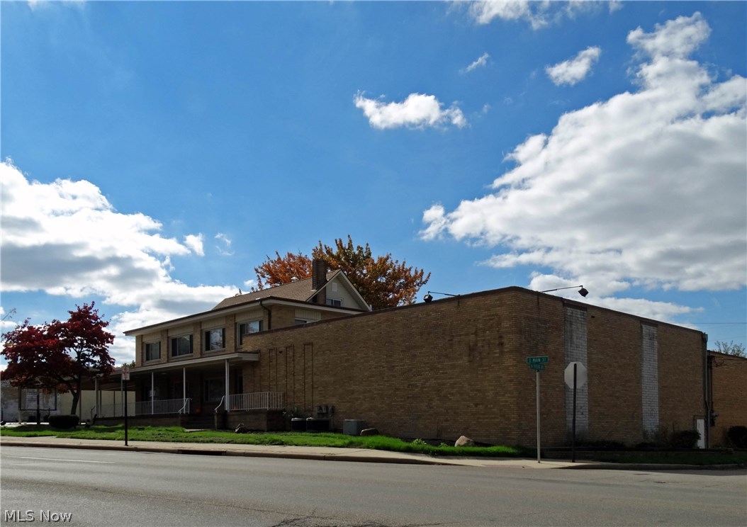 Over 11000 sq.ft. Tremendous value. Formerly used as a funeral home. Needs work (mostly decor) but could be thriving funeral home business (or other) again. 1st floor with office spaces and large meeting rooms. 2 apartments on 2nd floor with private entries. Basement area has area for meeting rooms plus kitchen and bath. There is a 5 car attached garage and parking for 85 cars. Property sits on 1.23 acres. Potential other uses: meeting center, hall, medical offices, day care center, group home. Effective year built is 1955.