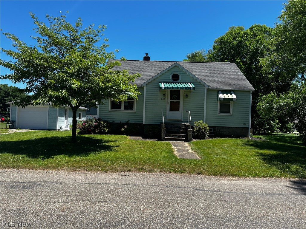 Welcome to this quant bungalow in Tuslaw Local Schools. Many updates including updated kitchen, new windows in '09, roof was replaced in 2010 to name a few that been made to this two bedroom two bath home. Includes shed for storage and a Semi-Truck garage that is 24x36 with 14 ft. garage door which has heat, water and electric. Also has a one car detached garage with newer garage door. A whole home generator is also included.