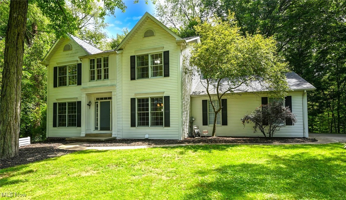 *Your Own Slice Of Paradise ~ Incredible Colonial In Tuslaw LSD Offers 3,500 Sq. Ft. Including 4 Bdrms, 2 Full, 2 Half Bathrms & FINISHED WALKOUT Basement On 2.11 ACRES Of Secluded Wooded Land! *Attached 2 Car Garage PLUS Outbuilding W/Detached 1 Car Garage & FINISHED EXERCISE RM Heated And Cooled W/Speakers, Front Door & Covered Patio ~ No Need For A Gym Membership, Equipment Stays! Shed *2 Driveway Areas *Close To Amenities Yet On A No Outlet Street Surrounded By Nature & Trees W/Beautiful Scenery ~ Large DECK For Entertaining And Covered PATIO Look Out To A Wooded Ravine! *Security System *Updates Include: NEW ROOF on Home AND Garage '25, New FURNACE And AC '22, REMODELED BATHRMS, KITCHEN, Carpet, Ceiling Fans, SKYLIGHT W/Remote Control Shade, LUXURY Plank Flooring & More! *2 FIREPLACES *Walk In To An Entryway W/Grand Chandelier *Elegant Formal Dining W/Wainscoting, Crown Molding *6 Ft. Tall Windows *The Eat In Kitchen Showcases Shiny Epoxy Countertops, ISLAND W/Breakfast Bar, Mosaic Tile Backsplash, Under Cabinet Lighting, Cabinets W/Soft Close Drawers, SS Hardware, New FARMHOUSE Sink, PANTRY, FULLY Applianced W/Double Oven, Double Freezer & More, Recessed Lighting, Bay Window *Arched Entryway And COLUMNS To The Family Rm W/DOUBLE SIDED Fireplace, Bookcases, Gorgeous COFFERED CEILING, Wall Of Windows W/Door To The Back Deck! *Living Rm, Modern Half Bathrm W/Wainscoting, Laundry Rm W/Tiled Floor, Cabinets & Front Loading Washer/Dryer That Stay! *Upstairs Are 4 Bedrms Including A Master Suite That Boasts A VAULTED CEILING, Sitting Area + LUXURY Ensuite GRAND Master Bathrm W/VAULTED CEILING, Velux Skylight W/Remote Control Shade, Sparkle Countertop, His & Her Sinks, Countertop Cabinet, Walk In Shower, Garden Tub Surrounded By 5 Windows, Extra VANITY Sparkle Countertop & Walk In Closet W/Upgraded Organization Units Including Dressers *2nd Full Bathrm W/His & Her Sinks *LOWER WALKOUT HUGE Rec Rm W/Fireplace + KITCHENETTE & Large 1/2 Bathrm *LIVE VIDEO
