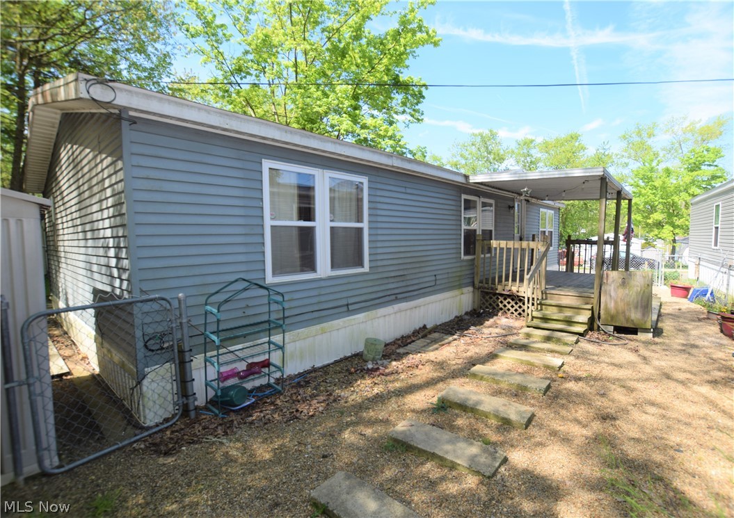 Welcome to 6236 Sue Lynn Drive in Ravenna, a 3-bedroom, 2-bathroom mobile home with 1152 square feet. Spacious eat-in kitchen with beautiful cabinets. Laundry room located right off the kitchen (dryer stays with home) with access to the backyard. Large owner’s suite was updated in 2019 and has a full bathroom. The main bathroom was updated in 2018. Flooring in living room and bedrooms installed in 2016. Yard is partially fenced in. Large covered front porch along with an uncovered porch in the back (patio furniture stays with home). Convenient storage shed (floor was replaced in 2016). 1988 Knoll Crest Model 5319 48x24 (Double Wide). This home is located close to Ravenna City Park, Route 59, numerous stores, and just a few miles away from Downtown Ravenna. Lot rent is $425 per month which includes Spectrum cable and internet! Don’t miss your chance to own this home!