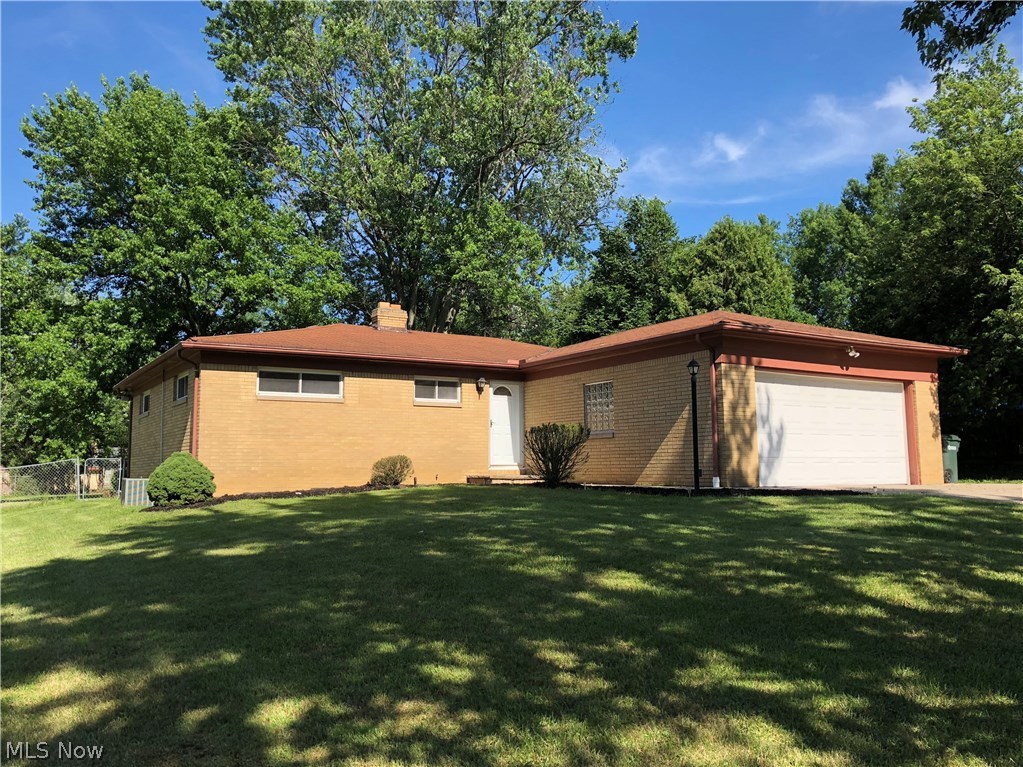 Beautifully Updated Brick Ranch with 3 Bedrooms and 3 Full Baths!! Attached Garage and Full Fenced Yard!! Great Home for First time Buyers or Downsizing! Open and Bright Floor Plan with Lots of Windows and Natural Light. The Kitchen has Updated Cabinetry with a Nice Size Eating Area and Breakfast Bar. The Living Room has a Large Window overlooking the Large Back Yard with a Partially Covered Deck across the Back. The Master Bedroom has A Private Master Bath!! Completing the First Floor are 2 additional Bedrooms and Guest Bath. The Lower Level is Completely Finished with another Full Bath!! Living Area with a Gas Fireplace and Additional Bedroom or Home Office. The Lower Level would make a Great In-Law or Teen Suite. This Home has Newer Windows Throughout, New Carpeting, Ceiling Fans and Lighting - Waterproofing has Been done and Sellers are Paying for Sewer Tie in - The Driveway is extended for Extra Parking and Convenient Turn Around. This Home has So Much to Offer!! Great Home in a